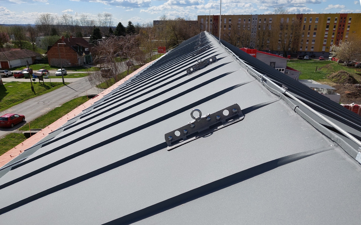 Standing seam metal roof with anchor point for safe access